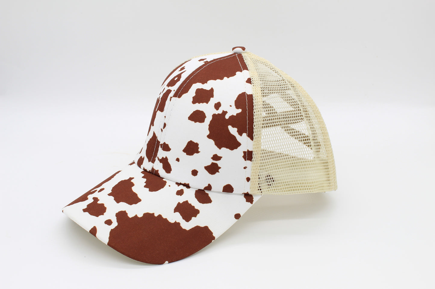 Brown Cow Print Criss-Cross Ponytail Hat