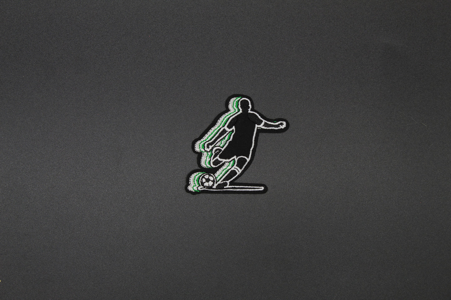 Soccer Player Embroidered Patch | Kicking Soccer Ball Iron-On Sports Patch in Green & Black