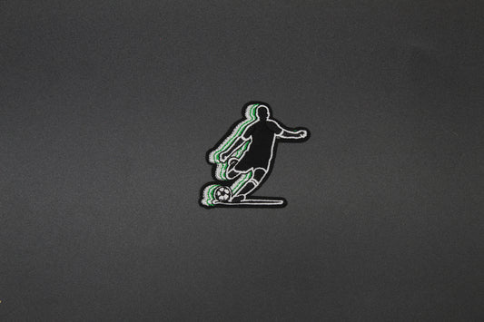 Soccer Player Embroidered Patch | Kicking Soccer Ball Iron-On Sports Patch in Green & Black