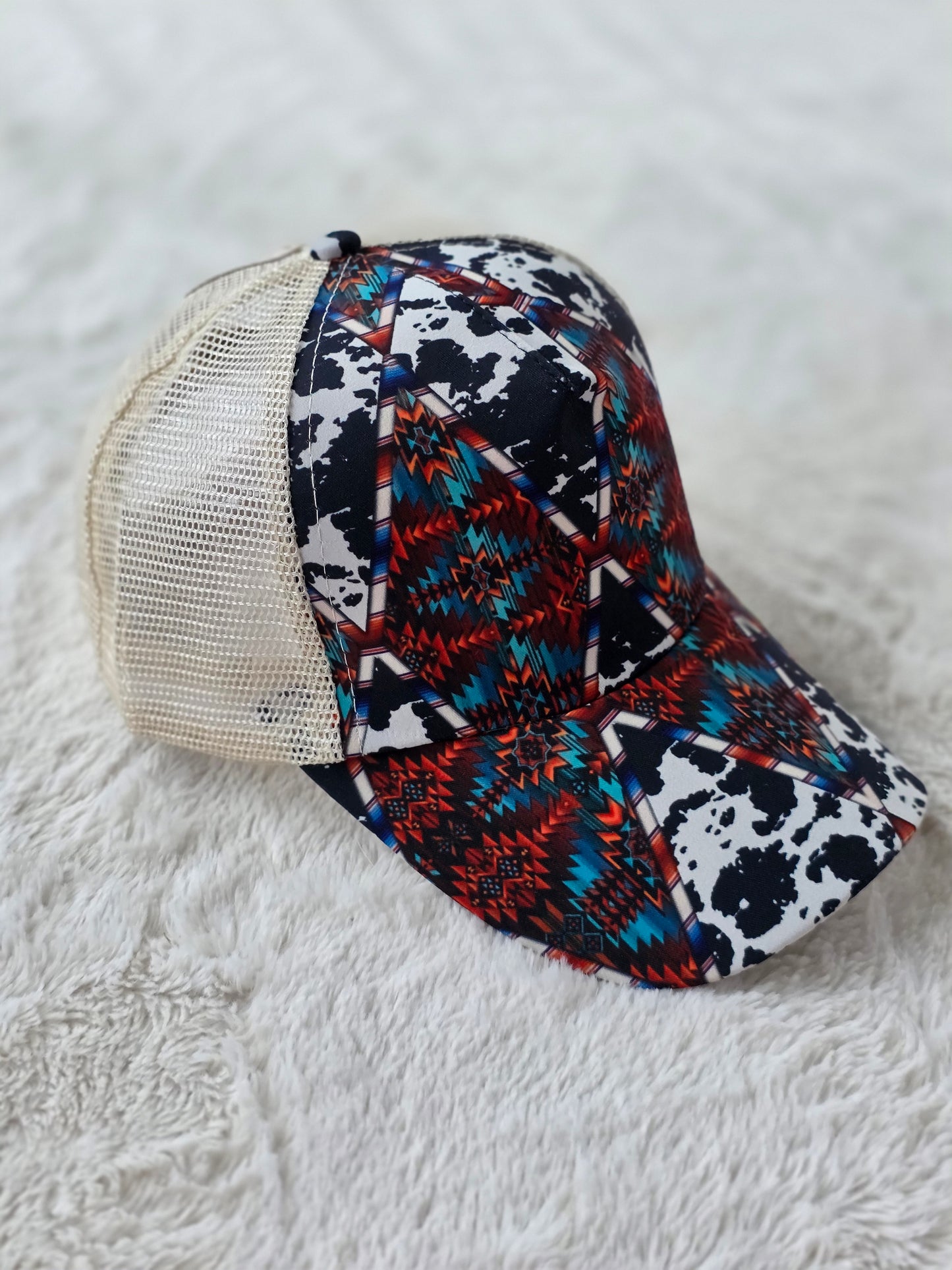 Southwestern Cow Print Criss Cross Ponytail Hat