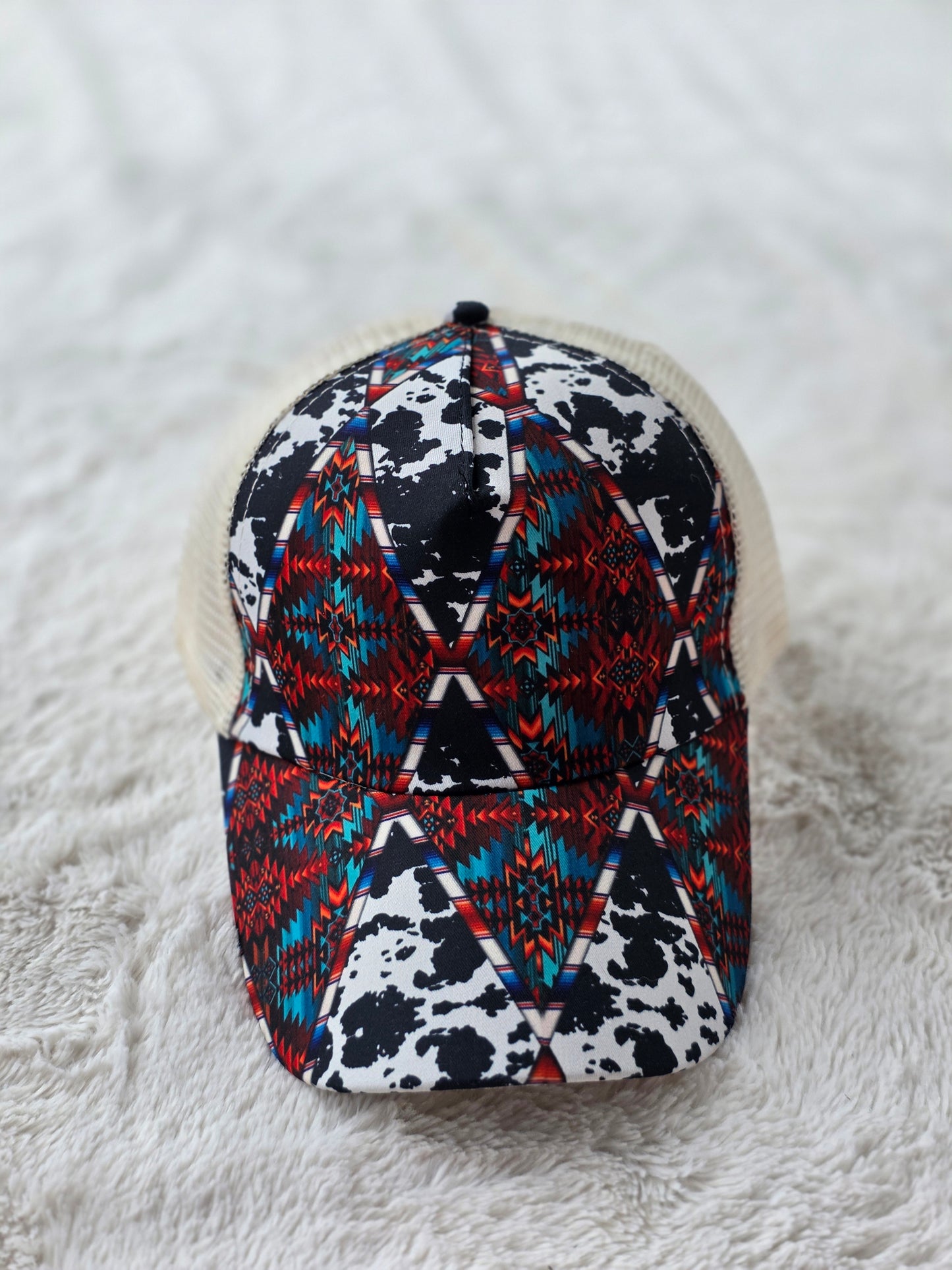 Southwestern Cow Print Criss Cross Ponytail Hat